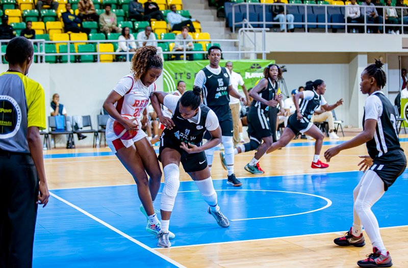 REG&#x27;s Nandy Linda Uwitonze tussling for the ball with Assouma Uwizeye f APR